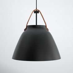 a black pendant light hanging from a ceiling fixture with a leather cord attached to it