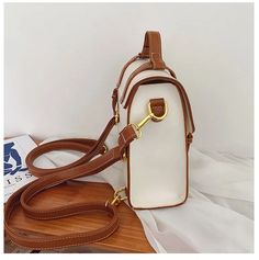 SPECIFICATIONSBrand Name: NIGEDUPlace Of Origin: GUANG DONG ProvincePlace Of Origin: GUANG DONG ProvinceMain Material: PUHandbags Type: Shoulder BagsGender: WOMENOrigin: Mainland ChinaCN: GuangdongLining Material: POLYESTERDecoration: rivetHardness: SOFTNumber of Handles/Straps: twoPattern Type: SolidInterior: Interior Zipper PocketOccasion: VersatileExterior: Silt PocketStyle: vintageModel Number: B733Closure Type: COVERSize: (20cm