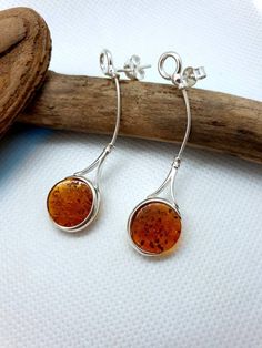 Stunning long modern Baltic Amber and aterling silver 925 earrings. With stamping. https://www.etsy.com/shop/AmberLithuania?ref=simple-shop-header-name&listing_id=780205095&section_id=27948198 Sterling Silver Round Linear Earrings, Sterling Silver Linear Earrings Gift, Sterling Silver Drop Linear Earrings As Gift, Sterling Silver Teardrop Linear Earrings For Gift, Sterling Silver Linear Pierced Earrings As Gift, Sterling Silver Pierced Earrings As A Gift, Teardrop Earrings With Bail As Gift, Sterling Silver Drop Linear Earrings For Anniversary, Amber Sterling Silver Dangle Earrings