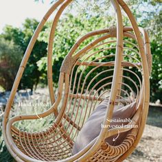 a hammock hanging from a tree in the yard with instructions on how to hang it