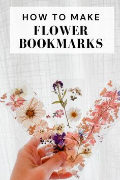 someone holding flowers in their hands with the text how to make flower bookmarks