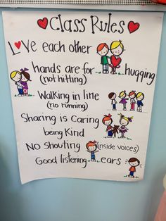 a classroom rules sign hanging on the wall