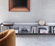 a living room with a book shelf filled with books