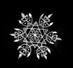 a black and white drawing of a snowflake with leaves on it's side