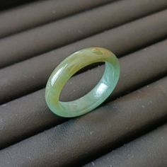 My shop, all the products come from different mining areas in Burma. Naturally formed jewel-grade jadeite, they are very beautiful. Support global testing products Ring Size:18.7MM(8.5US) Width: 5.6MM Thickness:3.1MM Weight:3.23g Packing:Gift Box ( Certificate included ) The color of the jade jade in Myanmar is different because of the customs of the region, and the subdivision method is slightly different. In the jade kingdom of Myanmar, the jade is divided into three categories and 12 grades. Green Natural Stones Ring, Handmade Green Jade Rings, Green Rings With Natural Stones, Green Jade Rings With Natural Stones, Green Opal Round Ring, Green Crystal Ring With Natural Stones, Green Jade Round Band Jewelry, Jade Jewelry With Natural Stones, Jade Ring With Natural Stones