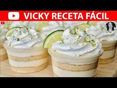 there are many small cupcakes with whipped cream and lime slices on top in this video