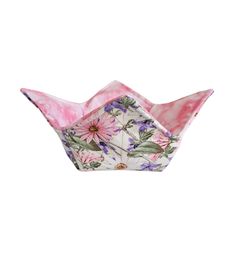 a pink and white flowered paper boat