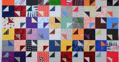 a quilt made with many different colors and patterns on it's sides, including squares