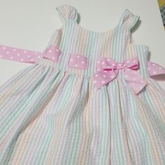 Seersucker Dress With Back Zip Lined Cute Pink Lined Dress, Cute Striped Cotton Dress, Cute Seersucker Dresses For Spring, Pink Seersucker Dress For Spring, Cute Gingham Seersucker Dresses, Cute Seersucker Dresses With Ruffles, Striped Spring Dresses For Playtime, Cute Seersucker Spring Dresses, Cute Ruffled Seersucker Dresses