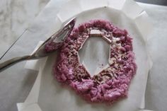 a plate with some food on it next to a fork and knife, sitting on a table