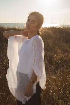 From now on, you'll pack this gorgeous layer in your carry-on for every trip and reach for it when styling a classic look for dinner out. Our mesh linen poncho, The Beachwalk Popover, is a secret weapon to simplified, versatile dressing because it elevates all your essential layers—think black tees, white button-downs, strappy camisoles, and more. Even over a swimsuit and wrapped pareo, it's chic. Open poncho style, pullover One Size garment, free sized Boat neck style, V-hemline Stitched slight Oversized Summer Poncho For Layering, Oversized Poncho For Summer Layering, One Size Summer Poncho For Layering, Summer Poncho For Layering, One-size Summer Poncho For Layering, White Tunic Kimono For Beach Cover-up, White Beach Cover-up Tunic, Oversized Long Sleeve Poncho For Beach Cover-up, Summer Beach V-neck Poncho