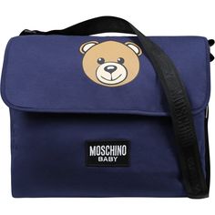 Color: Blue Blue mother bag in cotton, with adjustable shoulder strap, internal zip closure and velcro flap, internal changing mat. It is embellished with Teddy Bear and logo on the front. 39 x 39 x 19 cm. 100% Cotton. Wash at 30°C. Blue Flap Bag With Adjustable Strap, Blue Shoulder Bag With Embroidered Logo For Travel, Blue Travel Bag With Logo Patch, Blue Rectangular Shoulder Bag With Logo, Blue Rectangular Diaper Bag With Adjustable Strap, Blue Logo Crossbody Bag, Moschino Bag Handbags, Moschino Bear, Kids Teddy Bear