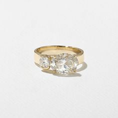 three stone diamond ring in yellow gold