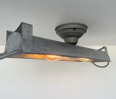 an industrial style light fixture with two lights