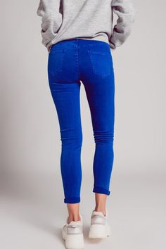 In an eye-catching electric-blue hue, these are high-waisted skinny jeans that are very elastic and stretchy. They boast of utility pockets on the sides and in the back as well as utility belt loops, which give you the option of adding a belt if you wish, and a zip fly with button closure. Because they’re high-waisted, they look great with a crop top or tee, or something bodycon that you can tuck in. We style them in our photos with our Super Soft High Neck Sweater in Gray.. The stretchy fabric Tan Scarf, Types Of Jeans, Utility Belt, Utility Pockets, High Neck Sweater, Blue China, Knitwear Tops, Stretchy Fabric, Stretch Denim