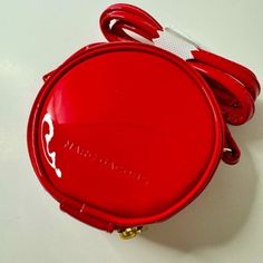 Marc Jacobs Red Patent Leather Round Crossbody Bag Nwot As Seen On Tik Tok Patent Leather Color: Cherry Red Total Strap Length: 49" Strap Drop: 22" Purse Diameter: 4" Purse Height: 2" Compact Red Travel Bag, Compact Red Bag For Daily Use, Round Crossbody Bag, Bags Marc Jacobs, Marc Jacobs Bag, Mini Bags, Cherry Red, Mini Bag, Marc Jacobs