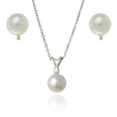 This classic freshwater pearl set features a pearl pendant and matching pear stud earrings. The earrings and pendant are both accented by a sparkling diamond, all set in 14k white gold. Whether worn as a beautiful bridal jewelry set on your wedding day or worn everyday, this jewelry set will become an instant favorite. 14k White Gold Freshwater Cultured Pearls Diamonds TCW .03 Jewelry set includes: Necklace - 16-18 inches long Earrings - Pierced Stud fitting Available in our New York Showroom Elegant White Gold Jewelry Sets With Brilliant Cut, Elegant White Jewelry Sets With Brilliant Cut, Classic White Diamond Jewelry Sets, Classic White Gold Jewelry Sets With Diamond Accents, Classic Diamond Jewelry Sets In White, Classic Brilliant Cut Jewelry Sets For Formal Occasions, Elegant Formal Jewelry Sets With Pearl Pendant, Elegant Pearl Pendant Jewelry Set For Formal Occasions, Classic White Gold Pearl Necklace In Pear Shape