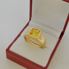 Gemstone: Yellow sapphire A gem certificate of authenticity will be provided at no charge. Treatments: Heated/Lattice Diffusion Specifications: 8.03x8.1mm, approx. 2.89 carats Color: As shown Stunning rare lemon yellow Clarity: Eye clean, almost loupe clean Cut: Cushion cut Weight: 16 grams. Ring size: 10, with all sizes available from 6.5 through 12 This is as fine and elegant a man's ring as you will ever find. The perfect blend of a fine gemstone matched up with a clean classic 14K yellow gol Gold Sapphire Ring With Cushion Cut, Gold Cushion Cut Sapphire Ring, Gia Certified Oval Gold Sapphire Ring, Formal Gold Ring With Yellow Sapphire, Formal Gold Sapphire Ring With Yellow Sapphire, Yellow Gold Sapphire Ring With Cushion Cut, Gold Cushion Cut Sapphire Ring Fine Jewelry, Cushion Cut Sapphire Ring In Yellow Gold, Formal Yellow Sapphire Ring With Diamond Cut