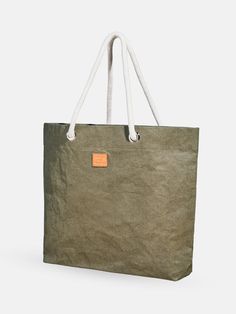 a green shopping bag with an orange tag hanging from it's side on a white background