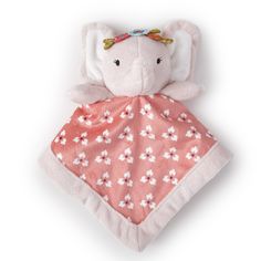 a pink elephant with white flowers on it's blanket