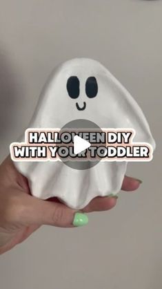 someone holding up a fake ghost with the words halloween diy with you toddler