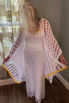 It is stunningly beautiful and delicate! White with yellow scalloped trim. Sized Large ~56"w x 27"l with 50" scarf. Hand made in USA. The inspiration must have come from the ol' ballet days 🥰 Machine wash in cold water. Reshape and lay flat to dry. White Shawl For Beach In Spring, One-size White Shawl For Summer, White Shawl For Spring, Spring Shawl With Lace Trim, White Bohemian Shawl For Spring, White Summer Shawl, Fitted White Shawl, Scalloped Trim, Orlando Fl