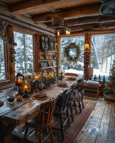 a dining room table with candles on it