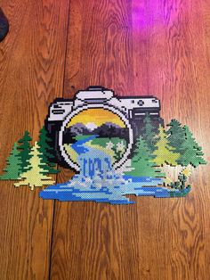 a camera sitting on top of a wooden floor