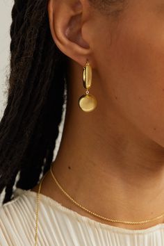 The ease and elegance of uniform dressing inform LIÉ STUDIO's jewelry. These 'The Marie' earrings are sculpted from gold-plated metal with spherical drop pendants. Wear yours as part of a graduating stack alongside other hoops. Uniform Dressing, Uniform Dress, Pearl Hoop Earrings, Stacked Jewelry, Earrings In Gold, Drop Pendant, Silver Hoops, Heart Of Gold, Silver Hoop Earrings