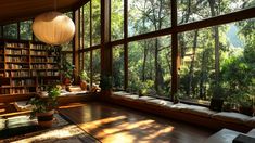 a living room filled with lots of books and furniture next to a window covered in trees