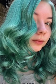 Ocean green is a unique blend of blue and green, reminiscent of the sea. It highlights pale skin with a cool, refreshing look. Click here to check out more best hair colors for pale skin to try. Blonde Hair Cool Tones Pale Skin, Pale Skin With Platinum Blonde Hair, Green Hair Pale Skin, Ash Blonde Pale Skin, Highlights Pale Skin, Bluish Green Hair Color