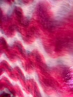 an animal print pattern is shown in pink and white colors, with red highlights on the fur