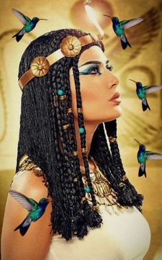 an egyptian woman with long braids and blue eyeshades surrounded by hummings