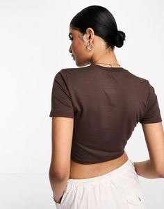 Tops.by.Nike.Your new go-to.Crew neck.Short sleeves.Nike logo embroidery to chest.Slim fit.Product Code: 127913928 Nike Casual Brown Tops, Casual Brown Nike Top, Sporty Brown Tops, Brown T-shirt For Spring Streetwear, Trendy Fitted Nike Tops, Brown Athleisure Crew Neck Top, Brown Crew Neck Athleisure Top, Brown Crew Neck Top In Athleisure Style, Sporty Brown Tops For Spring