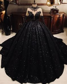 Make your special day even more special with this stunning High Neck Ball Gown Black Sequin Wedding Dresses Long Sleeves Sweet 16 Dress! Its gorgeous long sleeves and amazing high neckline make it perfect for that extra touch of fairy-tale style and elegance. Become the belle of the ball and make memories that will las Big Ball Gowns Black, Glittery Black Quince Dress, Black And Silver Quince Dress, Black Quinceanera Dresses With Sleeves, Quincenera Dresses Black And Gold, Elegant Long Sleeve Ball Gown For Quinceanera, Quinceanera Black Dresses, Black 15 Dress, Gold And Black Quinceanera Dresses