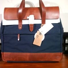 Timberland Nantasket Briefcase Size 17.7 X 19.7 X 5.9 In. 45 X 50 X 15 Cm Weight 3 Lb. 8 Oz. Premium Leather Trim External Back Pocket Unzips To Attach To Luggage Handle Adjustable, Detachable Shoulder Strap Laptop Sleeve Fits 15" Laptop Internal Security Pockets For Storage Blue Tote Briefcase For Travel, Blue Shoulder Bag Briefcase For Travel, Blue Shoulder Bag Style Briefcase For Travel, Business Bags With Leather Trim And Flap, Navy Rectangular Business Bag, Blue Satchel With Leather Handles For Business, Blue Rectangular Laptop Bag With Luggage Sleeve, Blue Laptop Bag With Luggage Sleeve, Blue Travel Briefcase With Adjustable Strap