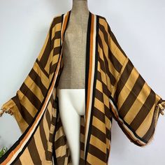 Timeless Chic Striped Kimono – Lashawn Janae Elegant Vertical Stripe Outerwear For Spring, Elegant Spring Outerwear With Vertical Stripes, Brown Open Front Summer Outerwear, Spring Striped Outerwear For Layering, Elegant Beach Outerwear With Open Front, Elegant Open Front Beach Outerwear, Elegant Fall Vacation Outerwear, Elegant Summer Beach Outerwear, Elegant Summer Vacation Outerwear