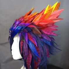 a mannequin head with colorful feathers on it