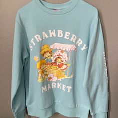 Strawberry Shortcake Sweatshirt Brand New Xs Blue Casual Sweatshirt With Cartoon Print, Cute Blue Sweatshirt With Graphic Print, Cute Blue Sweatshirt With Relaxed Fit, Fun Blue Cotton Sweatshirt, Fun Blue Crew Neck Sweatshirt, Blue Cotton Fun Style Sweatshirt, Strawberry Shortcake Clothes, Strawberry Shortcake Sweatshirt, Jcrew Collection