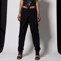 Look Beautiful In These Gorgeous Black Pants Featuring Cross Over Detailing At Zip/Hook Closure And Pockets At Waist And Back. Loose Fit, Unlined. Edgy Tapered Leg Pants, Edgy Tapered Leg Spring Bottoms, Edgy Straight Pants For Spring, Summer Tapered Leg Pants For Night Out, Edgy Spring Tapered Leg Bottoms, Spring Edgy Tapered Leg Bottoms, Edgy Spring Straight Pants, Fitted Tapered Leg Parachute Pants For Spring, Fitted Chic Parachute Pants For Fall