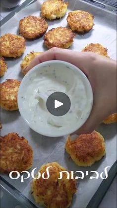 someone is dipping some food into a bowl