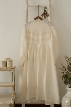 "This is a vintage type but new-made dress. Made of 100% cotton. Delicate lace embroidery flower decoration. Only white color and cream color available. Measures approximately: Bust: 55cm*2 (21.65\")*2 Length: 112cm (44.09\") Shoulder to Shoulder : 40cm (15.75\") Shoulder to Sleeve: 54cm (21.26\") ---------------------------------------- ❤ About Shipping Normally, it will takes 3-8 days to made the clothes after you submit the order. Free shipping for Worldwide countries. It takes about 20-30 da Cream Cotton Dresses With Lace Patchwork, Beige Lace Patchwork Cottagecore Dress, Beige Cottagecore Dress With Lace Patchwork, Cottagecore Beige Dress With Lace Patchwork, Vintage Long Sleeve Linen Dress For Spring, White Cotton Long Sleeve Vintage Dress, White Cotton Vintage Dress With Long Sleeves, White Long Sleeve Cotton Vintage Dress, Long Sleeve Lace Vintage Dress For Spring