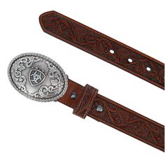 For the little cowboy or girl in your life, this belt will be loved by all. A floral tooled western belt, the keeper matches this great strap. The belt is finished off with a removable buckle that measures 2.25 by 3 inches. The buckle has etched scroll work and a raised Ariat shield and name. Made of Leather Little Cowboy, Scroll Work, Western Belt, Western Belts, Cowboy, Buckle, Floral, Leather