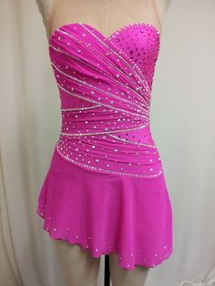 a pink dress with sequins on it