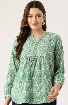 Green & White unique Jaipuri Cotton Print handmade top,features 3/4th sleeves and is mid length. extremely stylish and comfortable for every occasion,looks amazing with shorts or denims.This blouse is comfort & stylish .refer to the size chart or drop us a message if you need assistance. The beautiful detailing on the neck with the hand done embellishing and lace add a vintage boho chic look , while the print is eye catching as well  Model is wearing size S Also available in  S,M,L,XL Size chart Cotton Summer Blouse With Printed Motifs, Summer Cotton Blouse With Printed Motifs, Bohemian Printed Half Sleeve Tops, Casual Long Sleeve Blouse With Printed Motifs, Summer Casual Straight Kurta Blouse, Summer Kurta Blouse With Printed Motifs, Summer Blouse With Printed Motifs In Straight Kurta Style, Bohemian Green Tops For Festivals, Summer Straight Kurta Top With Block Print