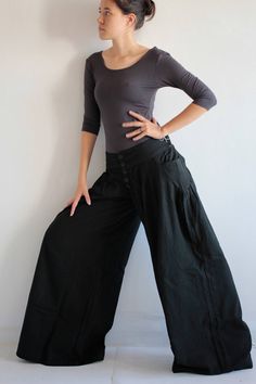 "This pair of pants is made to order! Please write down your measurements. Low waist Hip Out seam (from low waist to ankle) Simple in design, gathered front, with 5 buttons closure. Elastic in the back for flexibility. Low waist design. Super cute pocket on both sides. Long wide leg. Elegant piece. For your reference model is a size 8-10 US with 36\" bust, 30\" waist, 40\" hip and 5'6\" tall. Available in 4 sizes S Waist max 28-36\" Crotch to waist 22\" Hip max 42\" Length out seam 39\" Length i Fitted Cotton Wide-leg Pants, Relaxed Fit Wide Leg Harem Pants, Wide Leg Pants With Loosely Fitted Hips, Fitted Wide Leg Pants With Pockets, Fitted Wide-leg Cotton Yoga Pants, Wide Leg Yoga Pants With Pockets, Wide Leg Cotton Pants With Loosely Fitted Hips, Fitted Cotton Wide-leg Parachute Pants, Fitted Wide-leg Cotton Parachute Pants