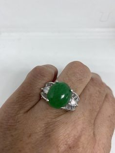 Vintage Lucky Green Nephrite Jade ring Large green nephrite jade Ornate German Silver Vintage ring, does not tarnish, NOT sterling Sizes 6, 6.5, 7,7.5 My jeweler can custom re size for a $10-$20 fee All rings are shipped free in the US in a nice gift box. Check out our over a THOUSAND great reviews Engraving is $4 per letter and is not always perfect depending on the piece. It can take a few days if the jeweler is busy. This is payable to Paypal Judithsltd@gmail.com Green Multi-stone Oval Cabochon Jewelry, Green Round Rings With Stones, Green Oval Multi-stone Gemstones, Oval Green Multi-stone Gemstones, Green Crystal Stone Ring For Anniversary, Green Three-stone Round Jewelry, Green Crystal Ring With Stones For Anniversary, Green Three Stone Round Jewelry, Green Oval Rings With Stones