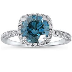 a blue diamond ring with diamonds around it