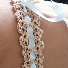 there is a crocheted lace on the back of a woman's body