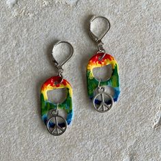 "Peace, love and pop tabs! Get groovy with these hand-painted \"tie dye\" earrings, which feature a peace sign charms. Jewelry to dye for! Flashback to the Summer of Love with groovy pop tab jewelry handmade by me! Pair your earrings with the matching bracelet to complete your retro look. You can see the matching bracelet here: https://www.etsy.com/listing/950984826/tie-dye-soda-pop-tab-bracelet-charm?ref=related-6&frs=1 All items are handmade by me in my smoke free, pet friendly home, and avail Adjustable Funky Earrings For Festivals, Hippie Nickel-free Adjustable Earrings, Hippie Style Adjustable Nickel-free Earrings, Hippie Adjustable Nickel-free Earrings, Hippie Multicolor Earrings As A Gift, Multicolor Hippie Earrings As Gift, Pop Tab Jewelry, Tab Jewelry, Tab Earrings